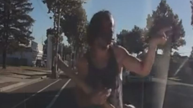 Article image for Masked man stops traffic at Bendigo and begins gesturing with a piece of wood