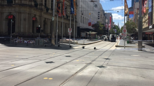 Article image for Bourke Street mall cleared by police after item found in floral tribute memorial
