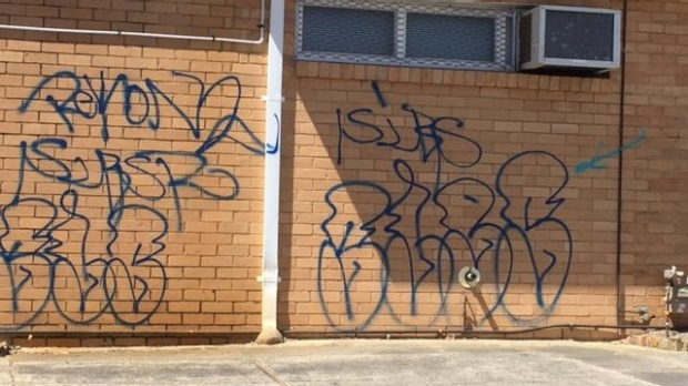 Article image for Heidelberg Heights police station covered in graffiti.