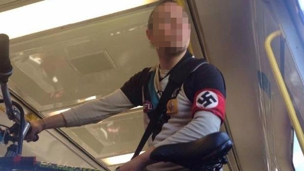 Article image for Port Adelaide supporter spotted on a Melbourne train wearing a Nazi armband