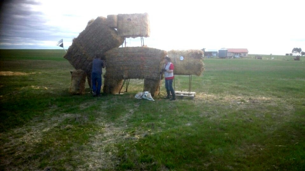 Article image for Controversial hay bale sculpture to be rebuilt after being set on fire