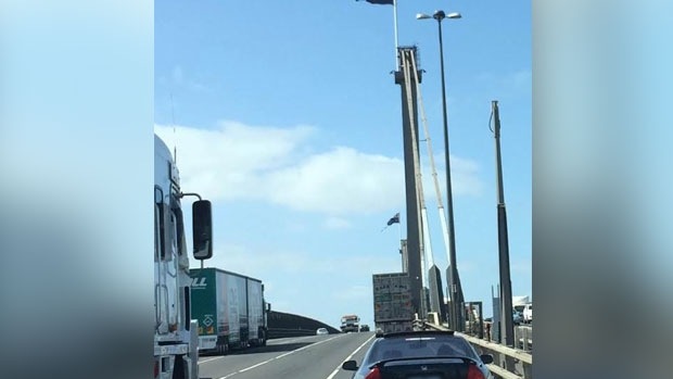 Article image for Worse for wear West Gate Bridge flags get a birthday