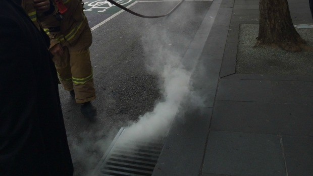 Article image for Mysterious smoke rising from a drain in the city