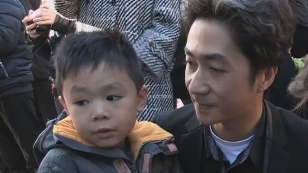 Article image for French father comforts young son in moving video after Paris terror attacks