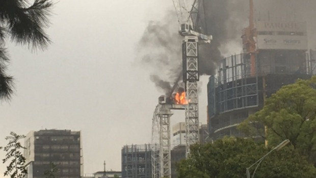 Article image for Crane bursts into fire, collapses on St Kilda Rd
