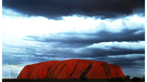Article image for Indigenous communities upset the government won’t ban climbing Uluru