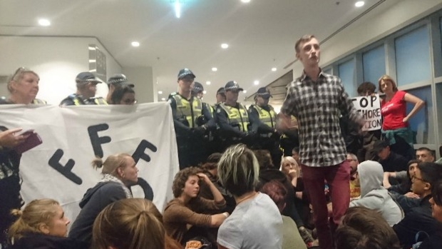 Article image for Protesters occupy Department of Immigration offices on Lonsdale Street