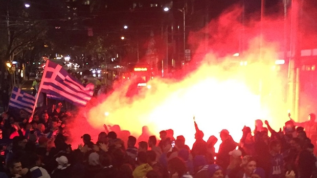 Article image for Soccer fans set off flares in Melbourne’s CBD last night
