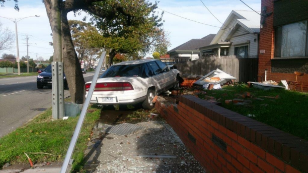 Article image for Car avoids oncoming traffic and slams into brick wall at Springvale