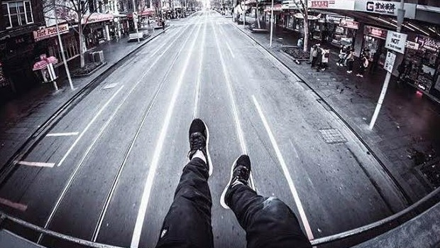 Article image for RUMOUR CONFIRMED: Fare evader sits on roof of Swanston Street tram and takes pictures