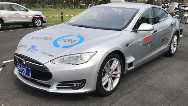 Article image for Neil Mitchell takes a Bosch enhanced ‘Tesla’ driverless car out for a drive at Albert Park