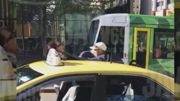 Article image for WATCH: Melbourne taxi driver insulted and abused by two men in Melbourne’s CBD