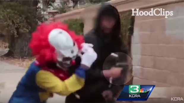 Article image for Scary clown prank goes wrong after prankster has a gun pointed at his face