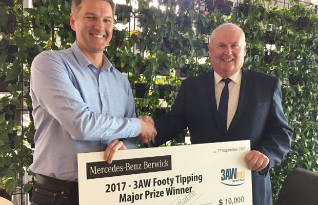 Article image for This year’s footy tipping winner picks up his prize!