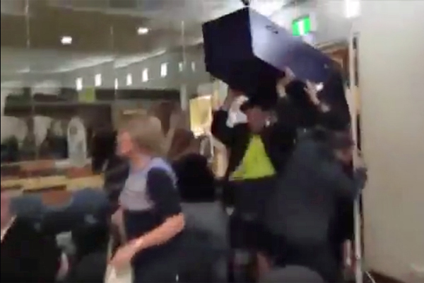 Article image for Councillors flee as coffin-bearing protesters storm Moreland meeting