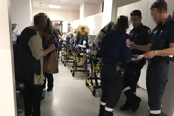 Article image for Bed strain: Hospital corridor stacked with trolleys