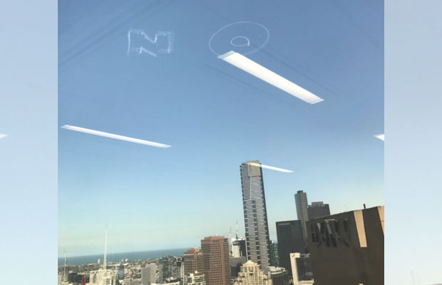 Article image for ‘NO’ written in the sky above Melbourne