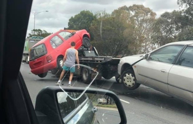 Article image for Car falls off tow truck while driving
