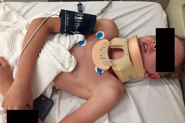 Article image for Boy jumps from 20m height into water and rides home with fractured vertebrae