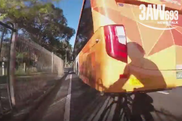 Article image for Video: Cyclist has close encounter with bus