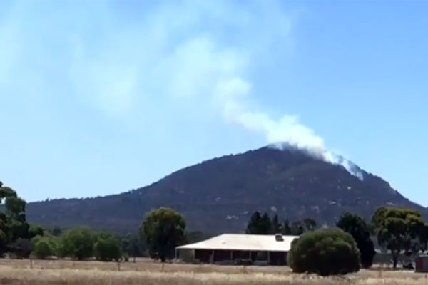 Article image for Dozens of fire crews battle to control grass fire south-west of Melbourne