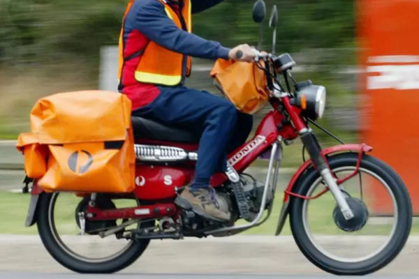 Article image for RUMOUR CONFIRMED: Postie’s bike allegedly stolen after coming to the aid of crashed motorbike rider