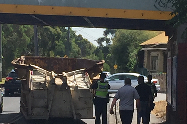 Article image for Truck loses load going under rail bridge in Melbourne’s inner north