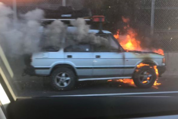 Article image for Delays in both directions after car fire on Monash Freeway
