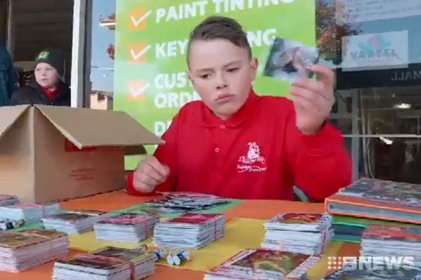 Article image for Little boy parts with beloved footy card collection for good cause