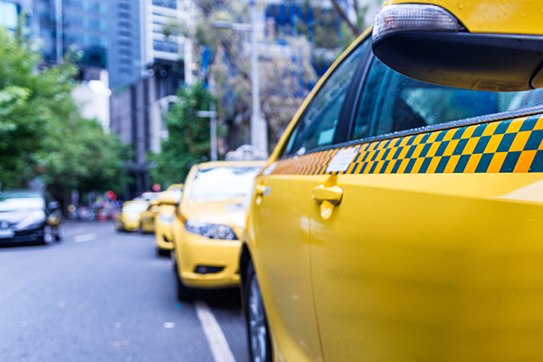 Article image for Taxi driver follows alleged thieves who robbed him at knifepoint and knocks them off their getaway scooter