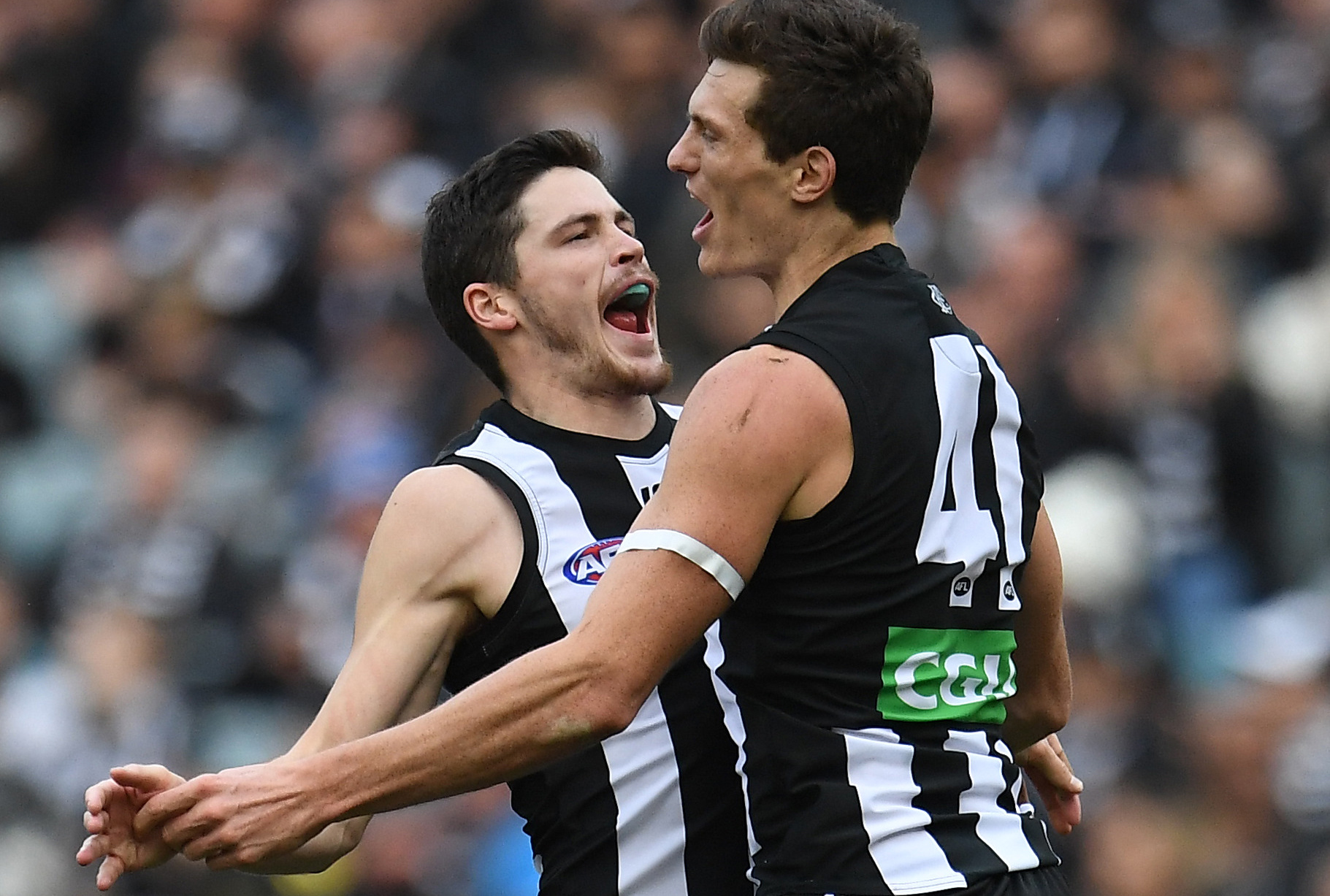 Article image for Collingwood celebrate victory over the old enemy at the MCG