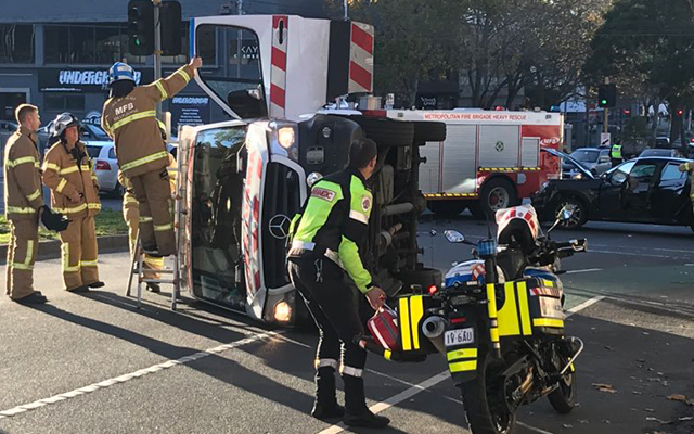 Article image for Ambulance on its side, paramedics in hospital after North Melbourne collision