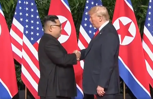 Article image for Smiling Trump, Kim Jong-un shake hands ahead of historic summit