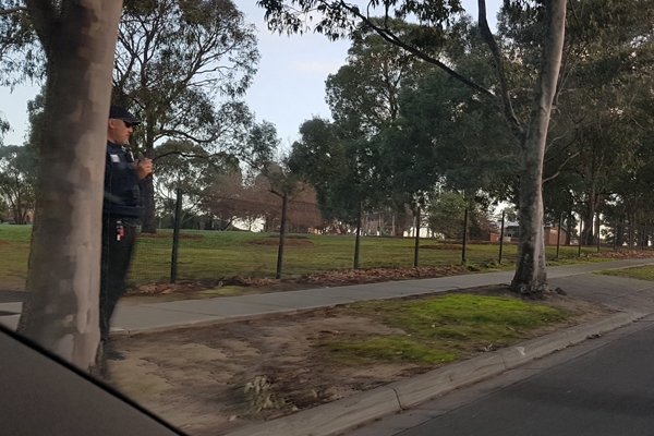 Article image for Police officer snapped hiding behind tree to nab driver’s details