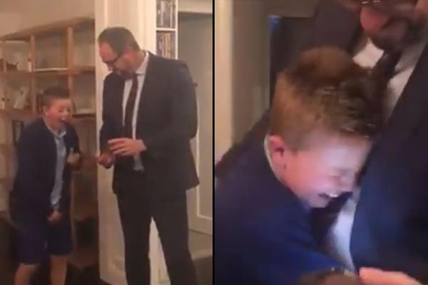 Article image for Little boy reduced to tears as Dad surprises him with Demons finals tickets