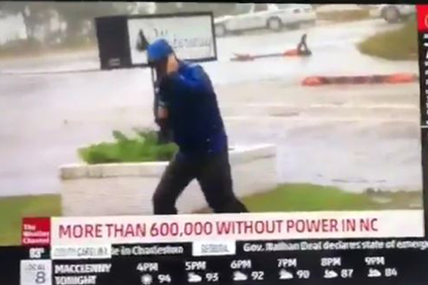 Article image for TV weatherman in the US caught out faking battle against gale-force winds