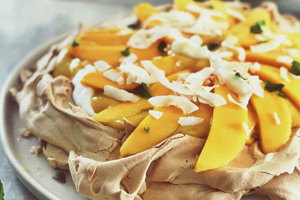 Article image for Recipe: Emma Dean’s Brown Sugar Pavlova with mango curd and coconut yoghurt