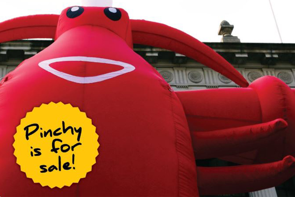 Article image for ‘Pinchy’ the 4.5 metre inflatable lobster has been put up for sale by Trades Hall