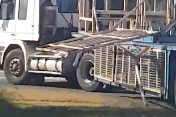 Article image for VIDEO: Truck takes out street sign with large piece of steel hanging off the back