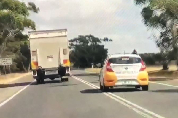 Article image for Video: Vehicles forced off road as car overtakes truck on double lines