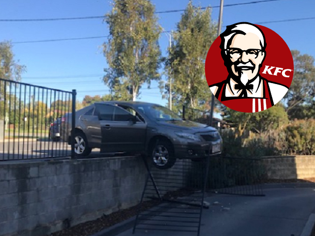 Article image for Car ploughs into fence, forces KFC drive-thru shutdown