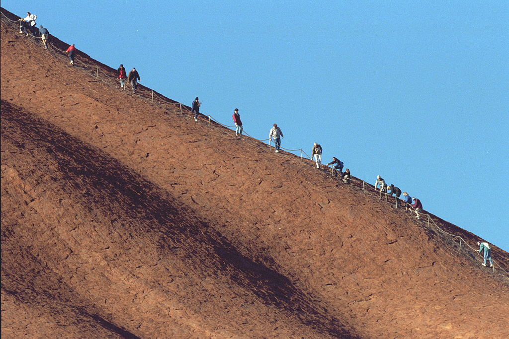 Article image for Tourists flock to Uluru ahead of climb ban, leaving ‘serious mess’