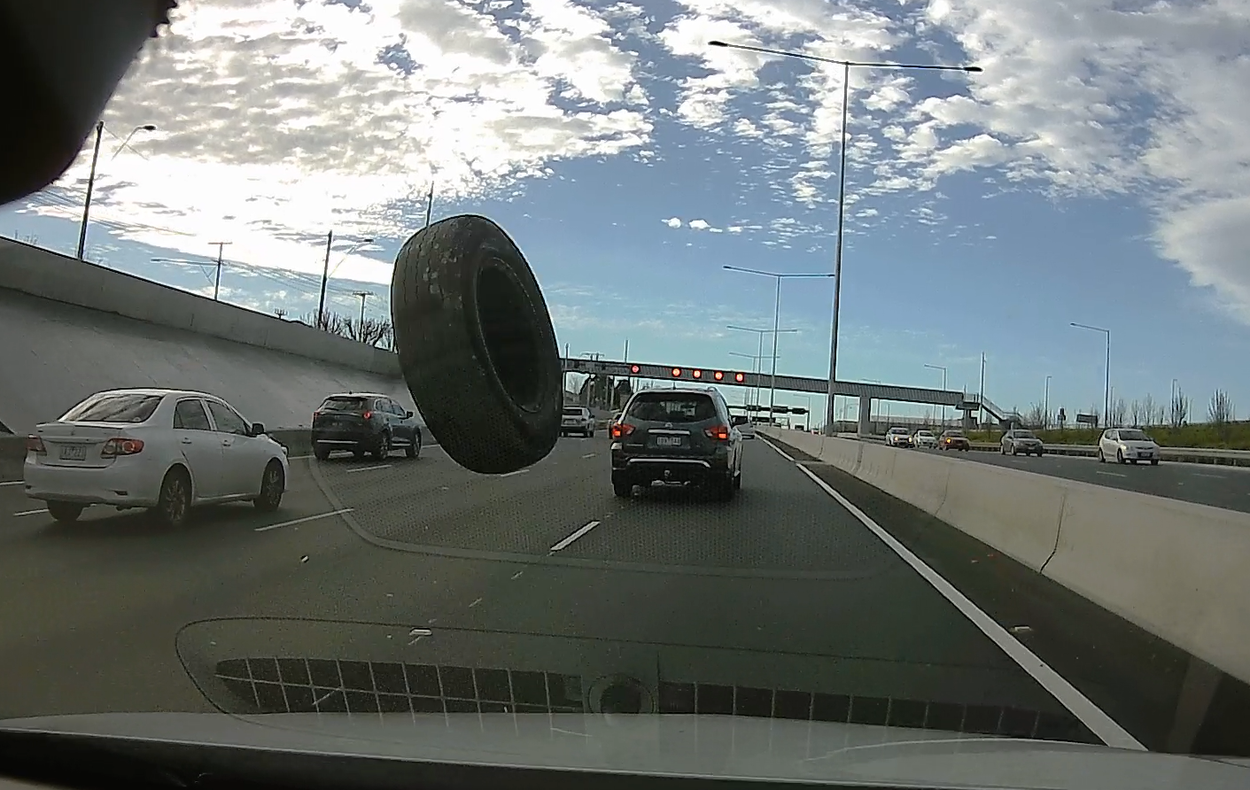 Article image for Dramatic dashcam footage captures the moment a rogue tyre struck two vehicles