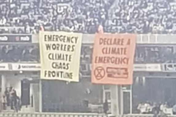 Article image for Climate Change protesters hang banners inside the MCG