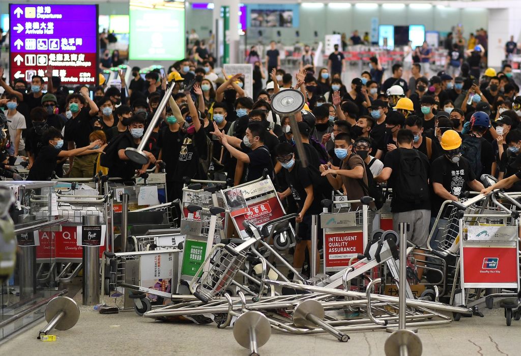 Article image for Flights resume at Hong Kong airport after protests force two day shutdown