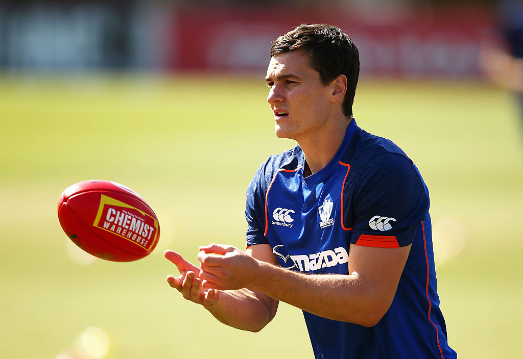 Article image for North Melbourne defender Scott Thompson announces retirement