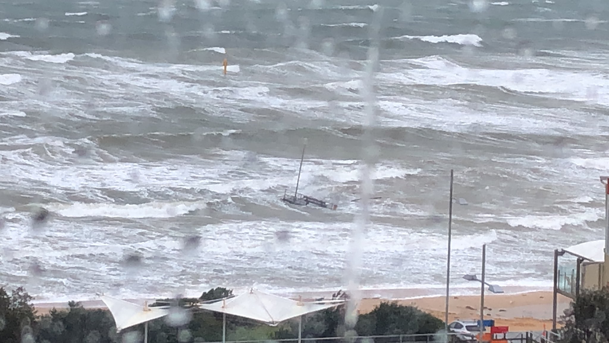 Article image for Wild weather: Frankston Pier snaps, planes grounded and trees down as extreme winds lash the state