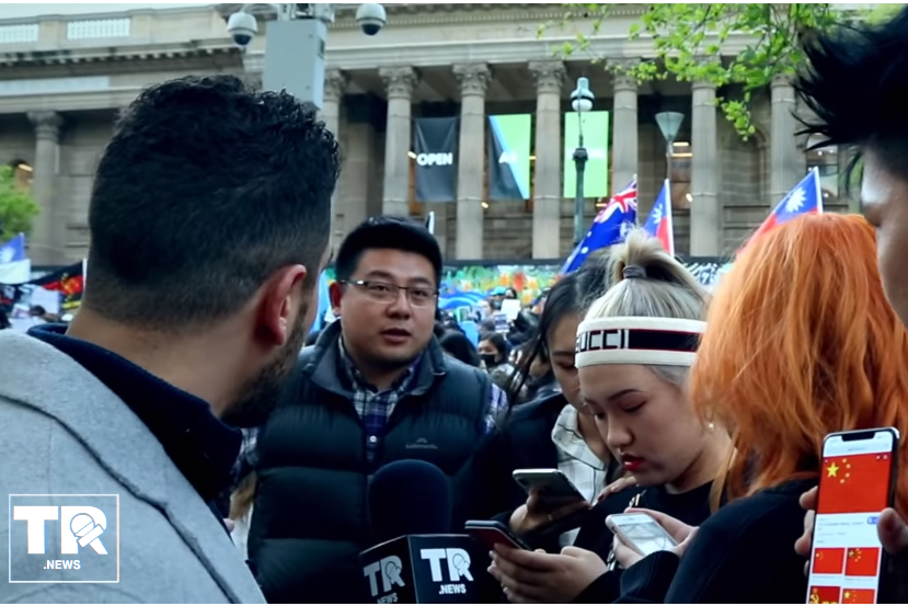 Article image for Video of alleged Chinese spy intimidating students at a Melbourne protest sparks foreign interference fears