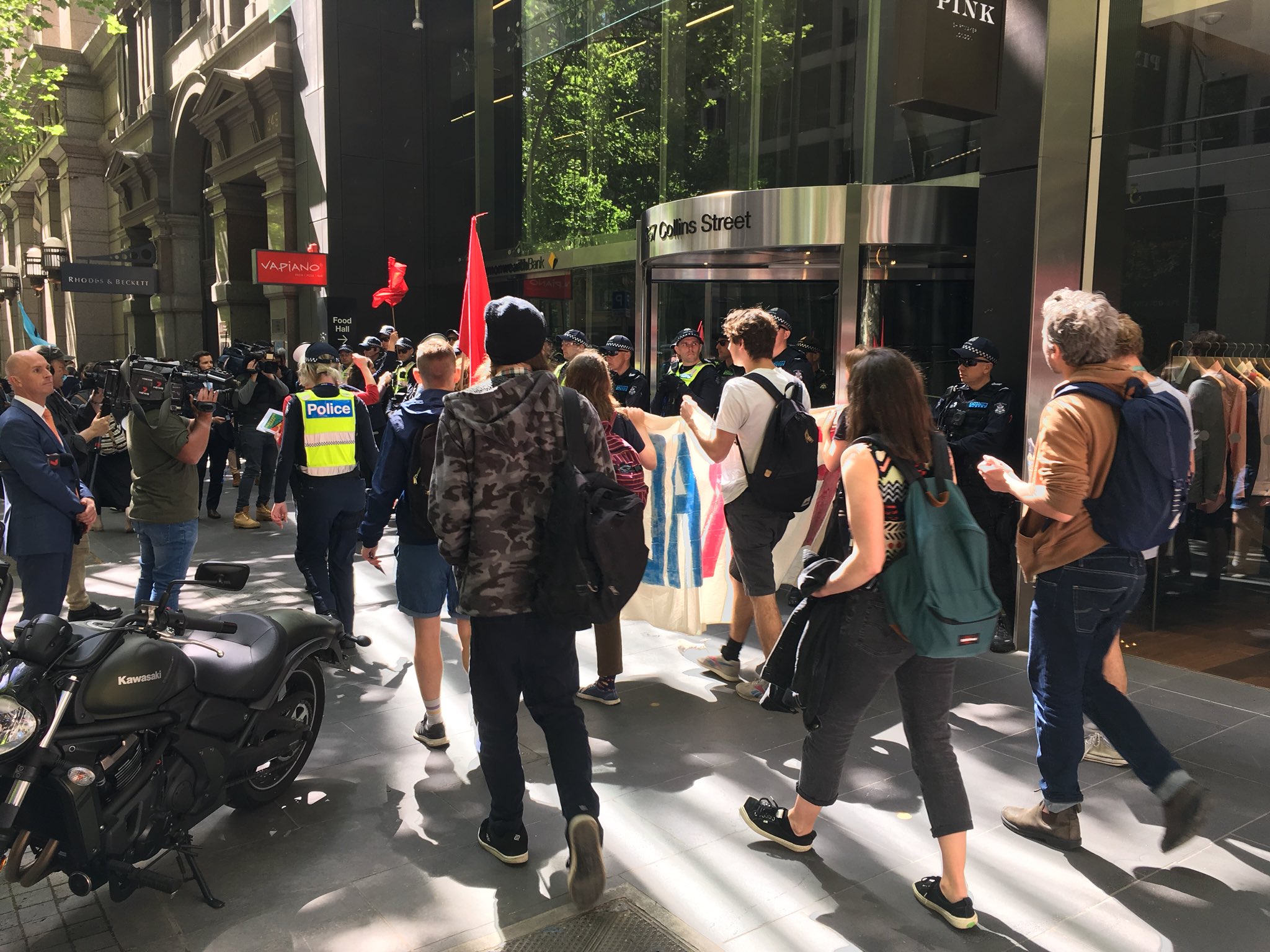 Article image for Anti-mining protesters block Collins Street as week of disruptions kicks off