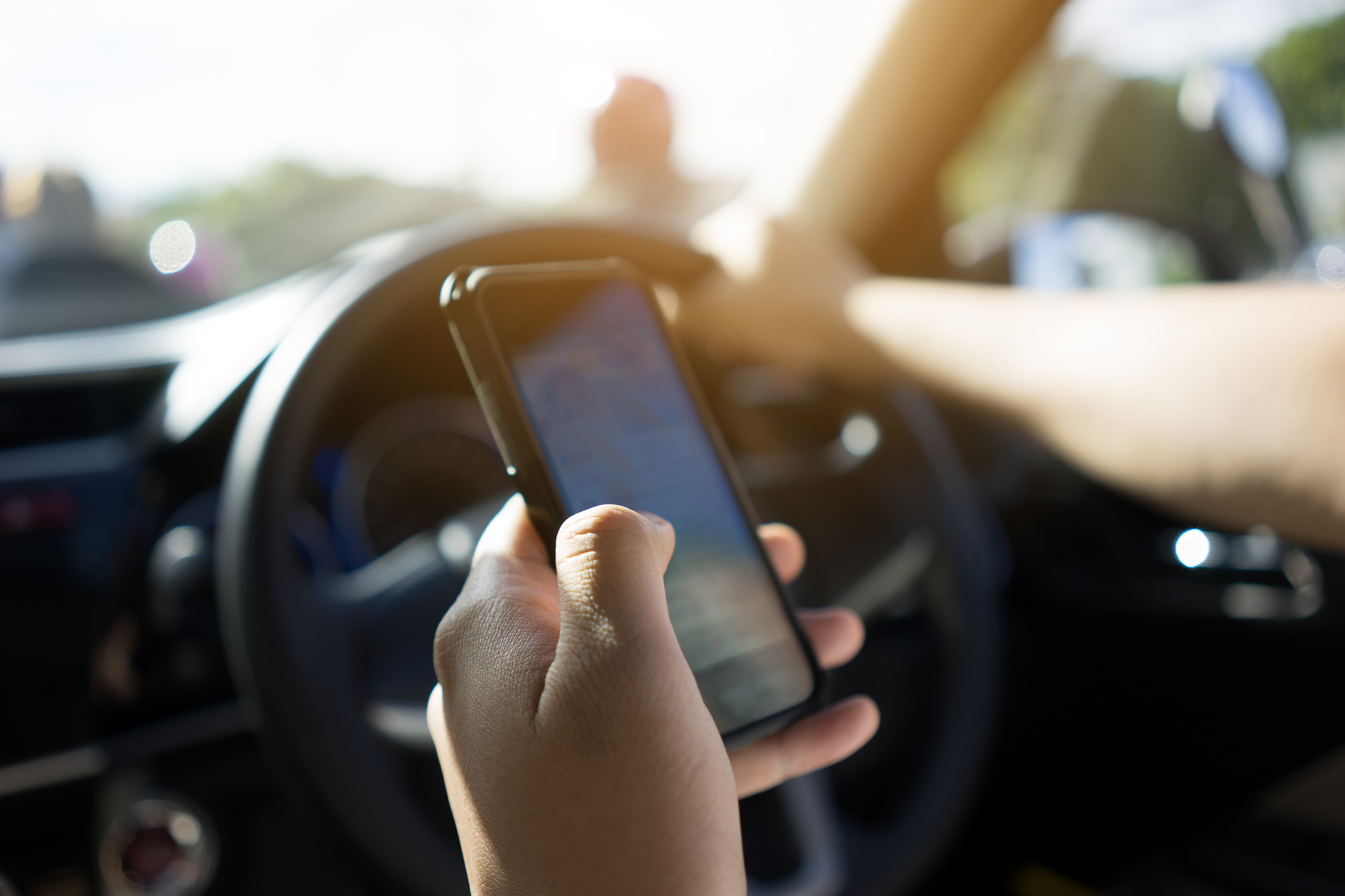 Article image for Surgeons call for stricter punishments for drivers using mobile phones